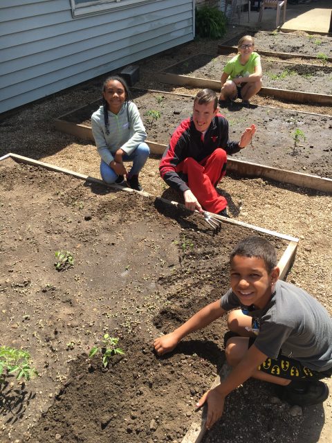Kids Corps members gardening with Matt.
